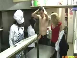 Kitchen staff have their hands full of their customers dong