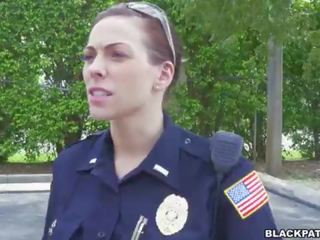 Female cops pull over black suspect and suck his phallus