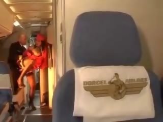 Lascivious stewardess rides a phallus inside both holes