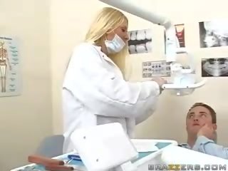 Marvellous teen busty blonde dentist movs her boobs to a patient